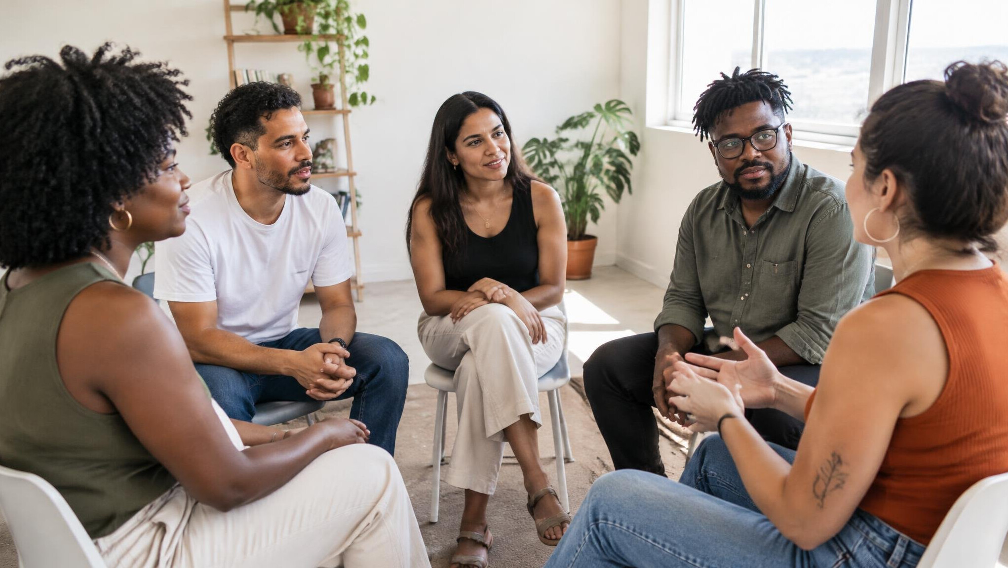 Group of people having an open discussion in a bright meeting room
