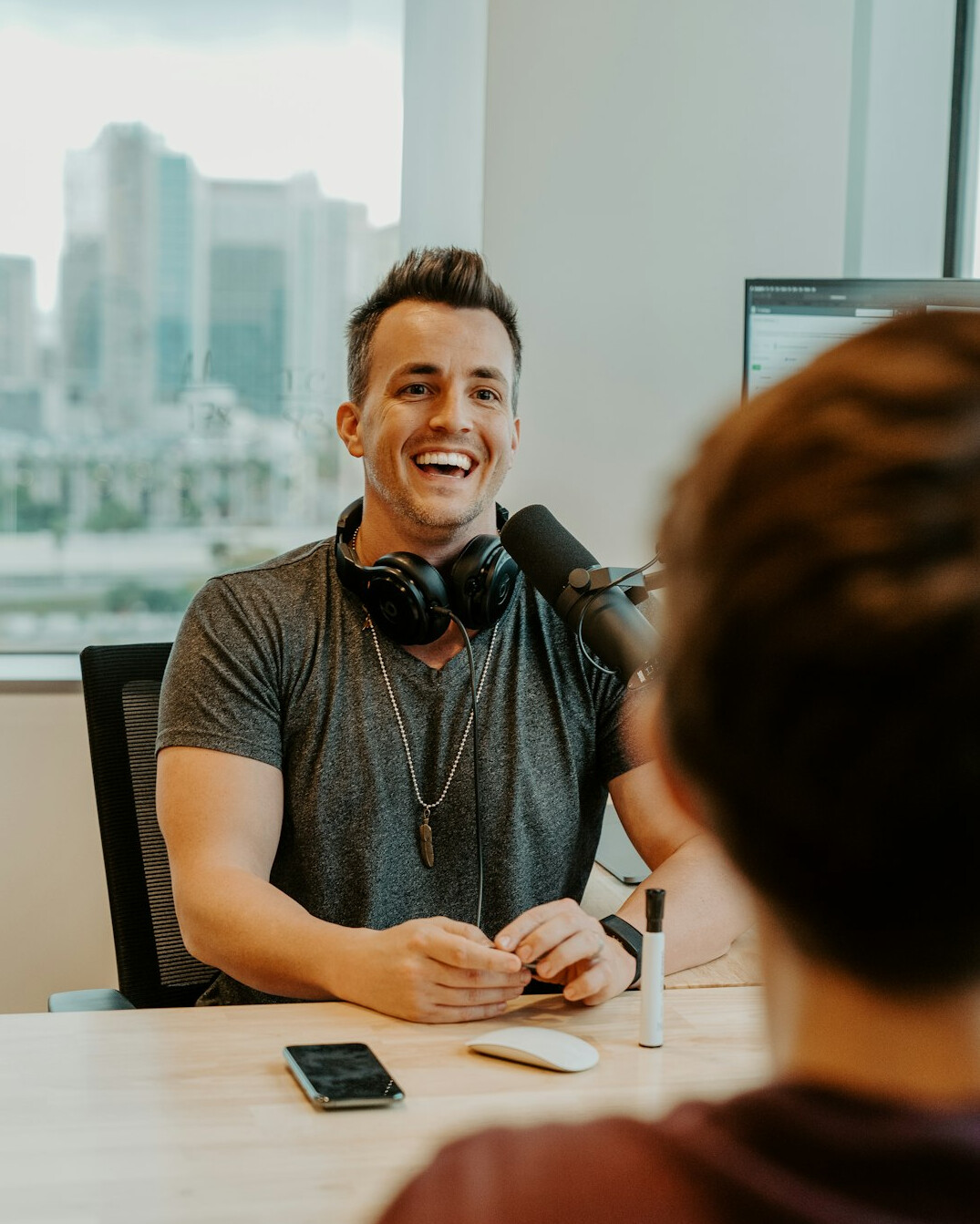 man smiling during discussion