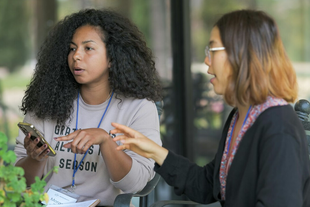 woman presenting to small group